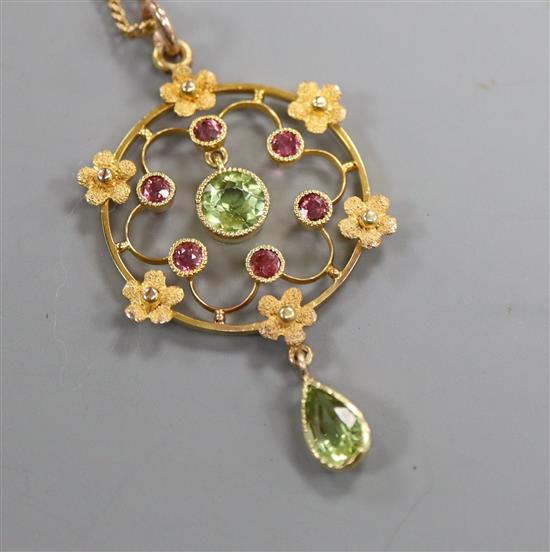 A peridot and amethyst openwork gold pendant (tests as 14ct) on fine chain, pendant 38mm.